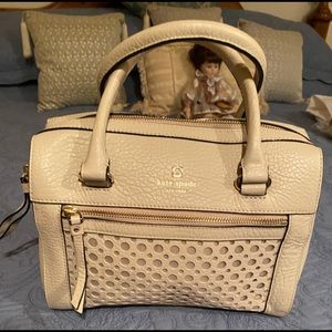 Kate spade satchel with strap included.